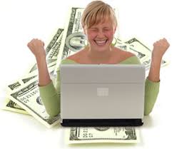 women excited expression on computer, with paper bill money floating behind her