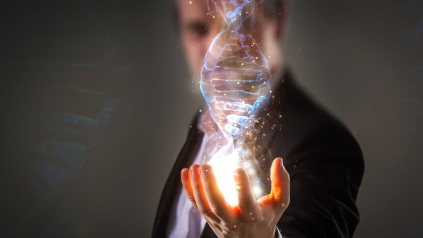 man holding DNA chain in hand bio-hacking