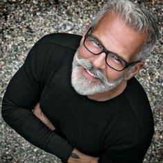 natural soap image from above of older man smiling with beard, mustashe, and glasses arms crossed